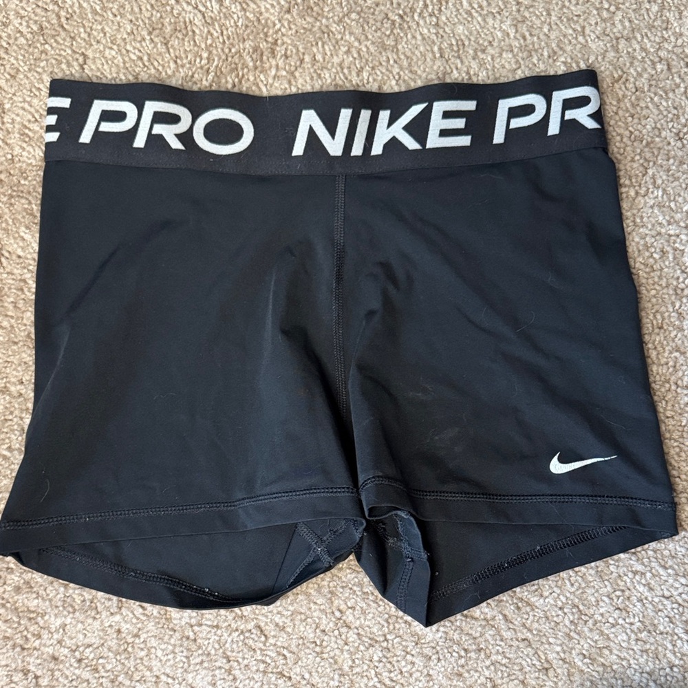 Nike Black Athletic Compression Shorts with White Swoosh